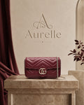 Mini Chiquito Burgundy on marble pedestal