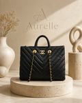 Chevron quilted tote on travertine pedestal