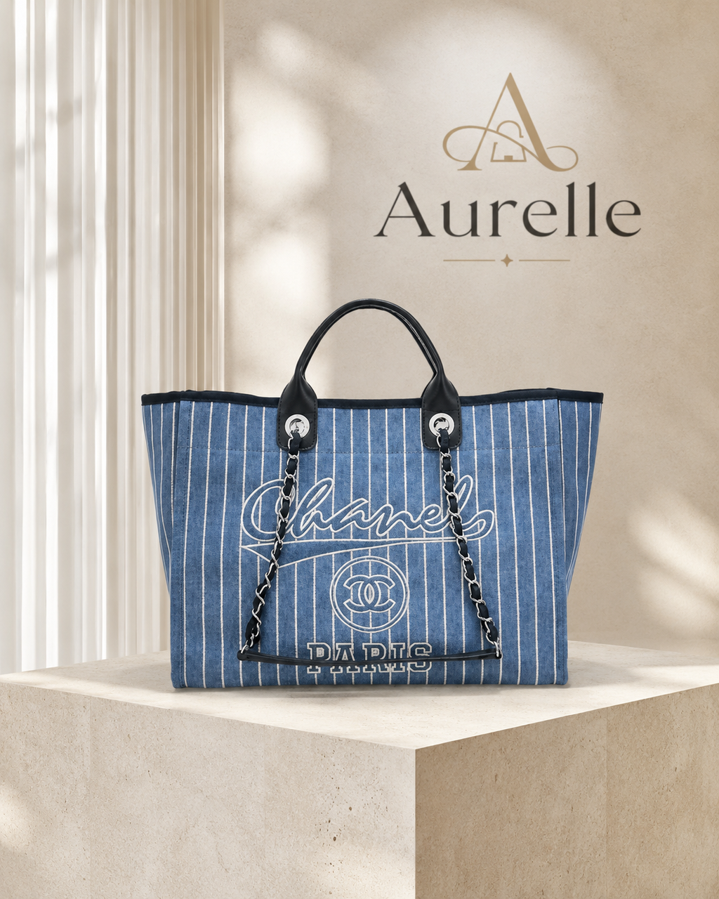 Riviera Striped Denim Tote on stone pedestal