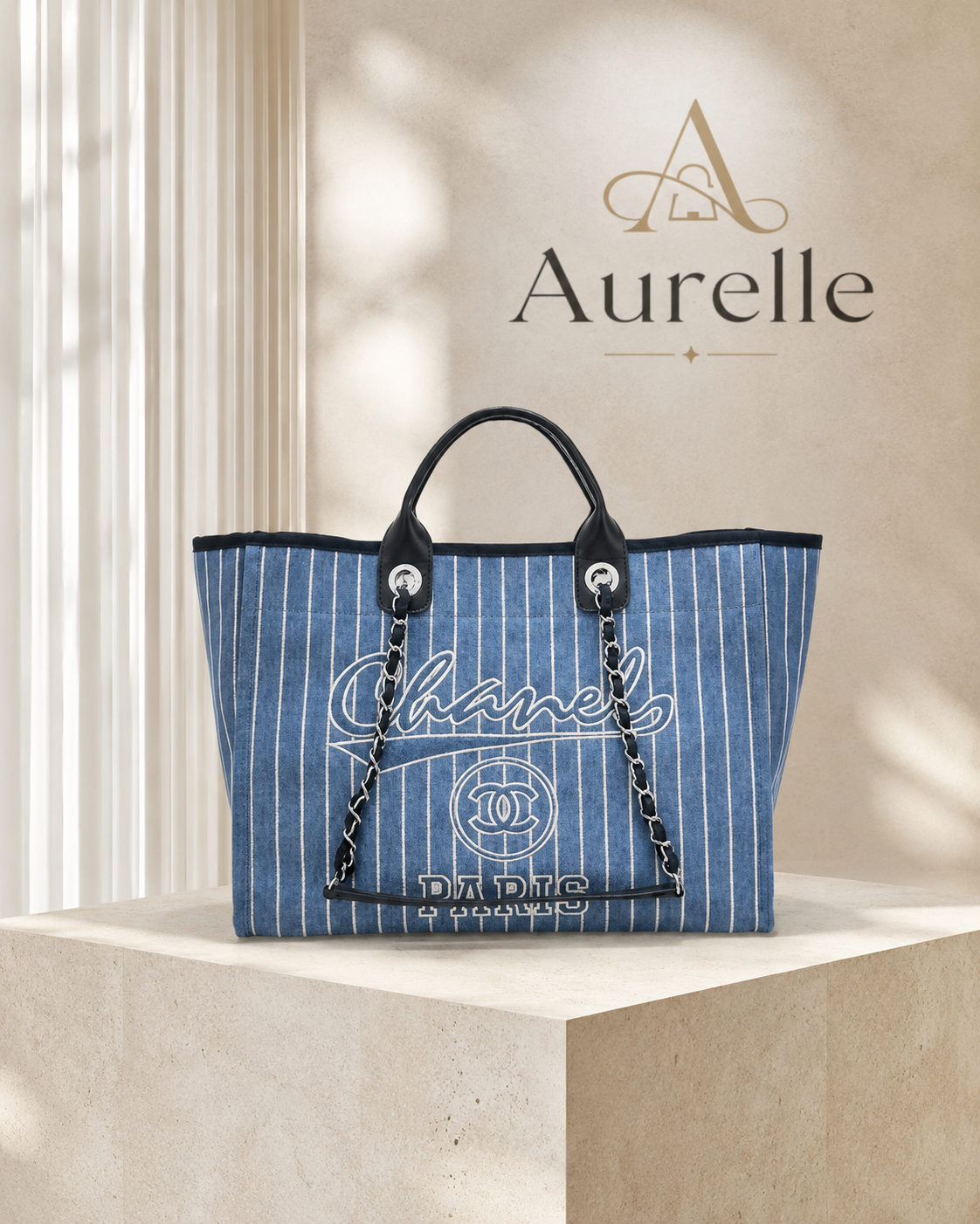 Riviera Striped Denim Tote on stone pedestal