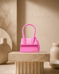 Mini Chiquito Pink on travertine pedestal