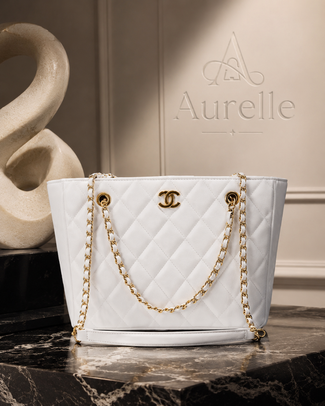 Ivory chain tote on black marble display
